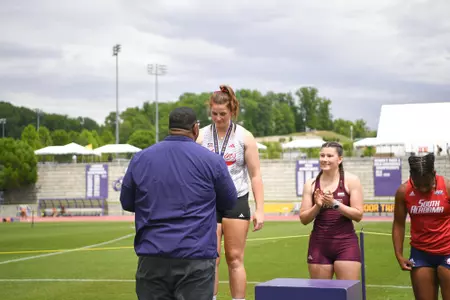 Lily Murray receives her medal at the 2025 SBC Outdoor Championships