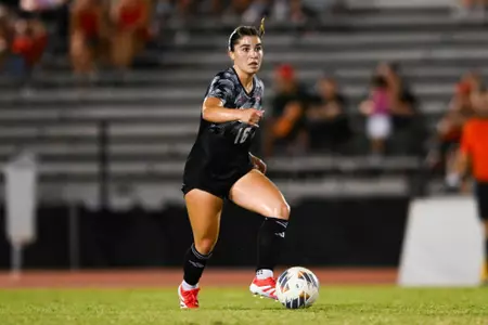 Sisley Stephens dribbles the ball against Lamar