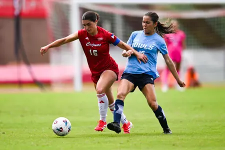 Sisley Stephens fights for the ball against Rice