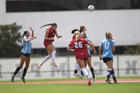 Salma Elahimer attempts a header against Rice