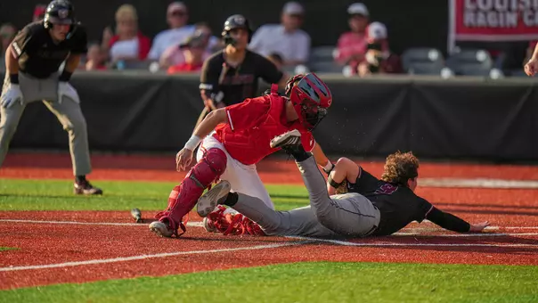 Louisiana's Colt Brown tags out Missouri State's Logan Fyffe at the plate in the ninth inning in Friday's season opener at M.L. "Tigue" Moore Field at Russo Park