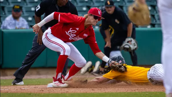 Drew Markle applies the tag on Southern Miss' Ben Higdon on a stolen base attempt in Sunday's Sun Belt Conference Baseball Championship Game at DABOS Park
