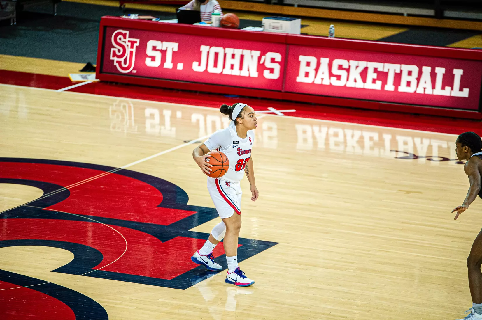 Camree Clegg brings the ball up the floor for the Johnnies.