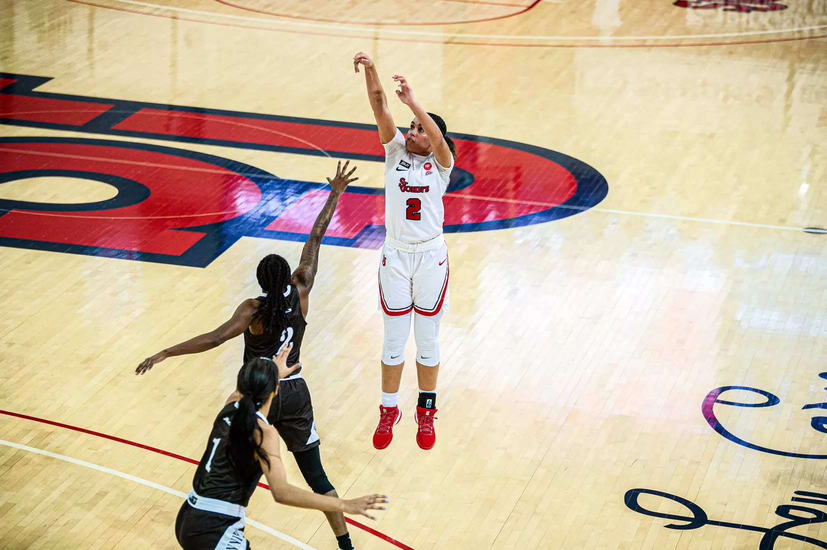 Leilani Correa knocks down a three, closing out the game with an 11-point and 10-rebound double-double.