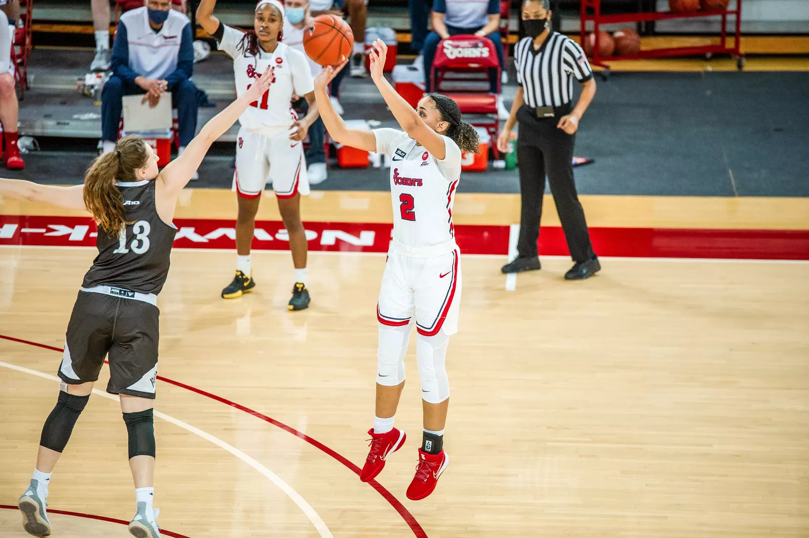 Leilani Correa pulls up for a deep two and knocks it down.