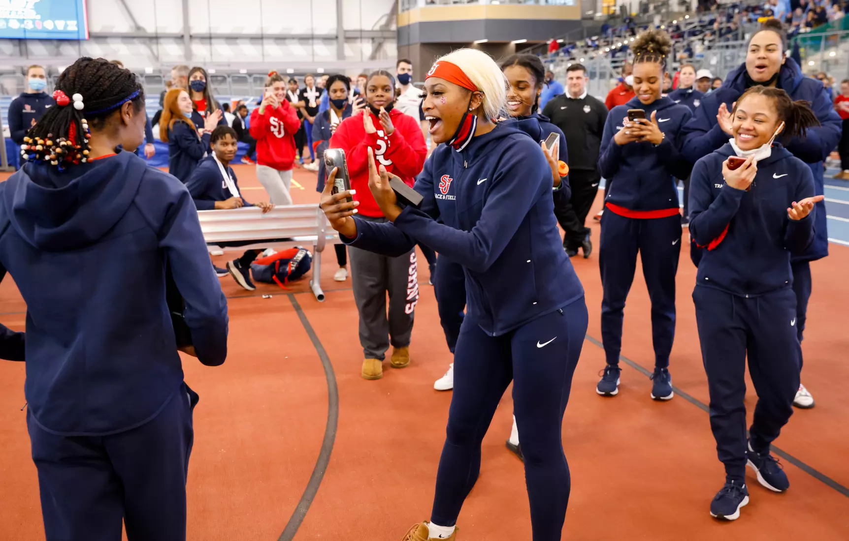 Team celebrates with Leah Anderson.