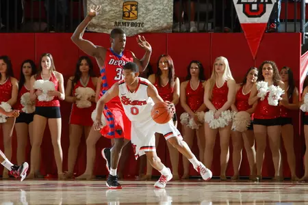 Jamal Branch dribbles through contact in St. John's 79-74 overtime win over DePaul on Jan. 30, 2013.