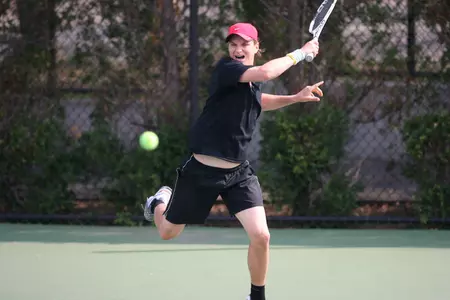 Senior Valentin Mihai picked up a huge win at No. 2 singles at the National Tennis Center on Saturday night.