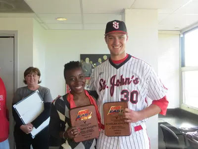 Rikka Lovely and Sean Hagan acceptingtheir American Eagle BIG EAST Institutional Scholar-Athlete Award