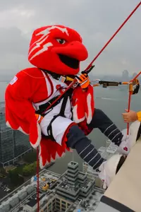 Johnny Thunderbird prepares to scale down the side of the Harborside Financial Center building during last year's Over The Edge event.