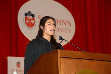 Junior Shawna-Lei Santos speaking at the investiture of Conrado