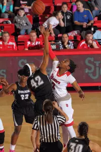 Junior Amber Thompson contests the opening tip in Saturday's victory over Providence.
