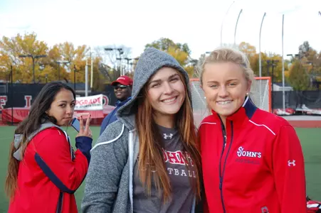 Krystal Puga and Hannah Anderson cheer on their teammates.