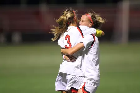 Rachel Daly and Georgia Kearney-Perry celebrate a game-winning goal against Xavier