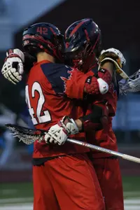 St. John's attackmen Stefan Diachenko (left) and Eric DeJohn (right) celebrate a Red Storm goal Saturday night at Villanova.