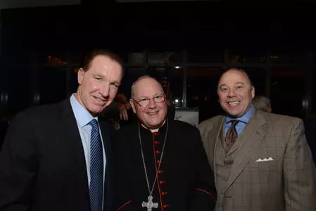 St. John's head coach Chris Mullin and associate head coach Barry Rohrssen with His Eminence, Timothy Cardinal Dolan at CYO Club of Champions Tribute