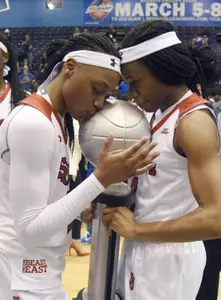 Danaejah Grant (left) and Aliyyah Handford (right) pose with the 2016 BIG EAST Championship Trophy