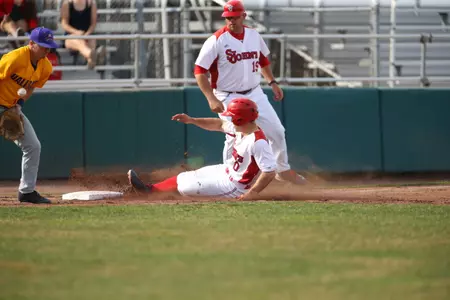 Mike Antico slides into third after hitting a triple