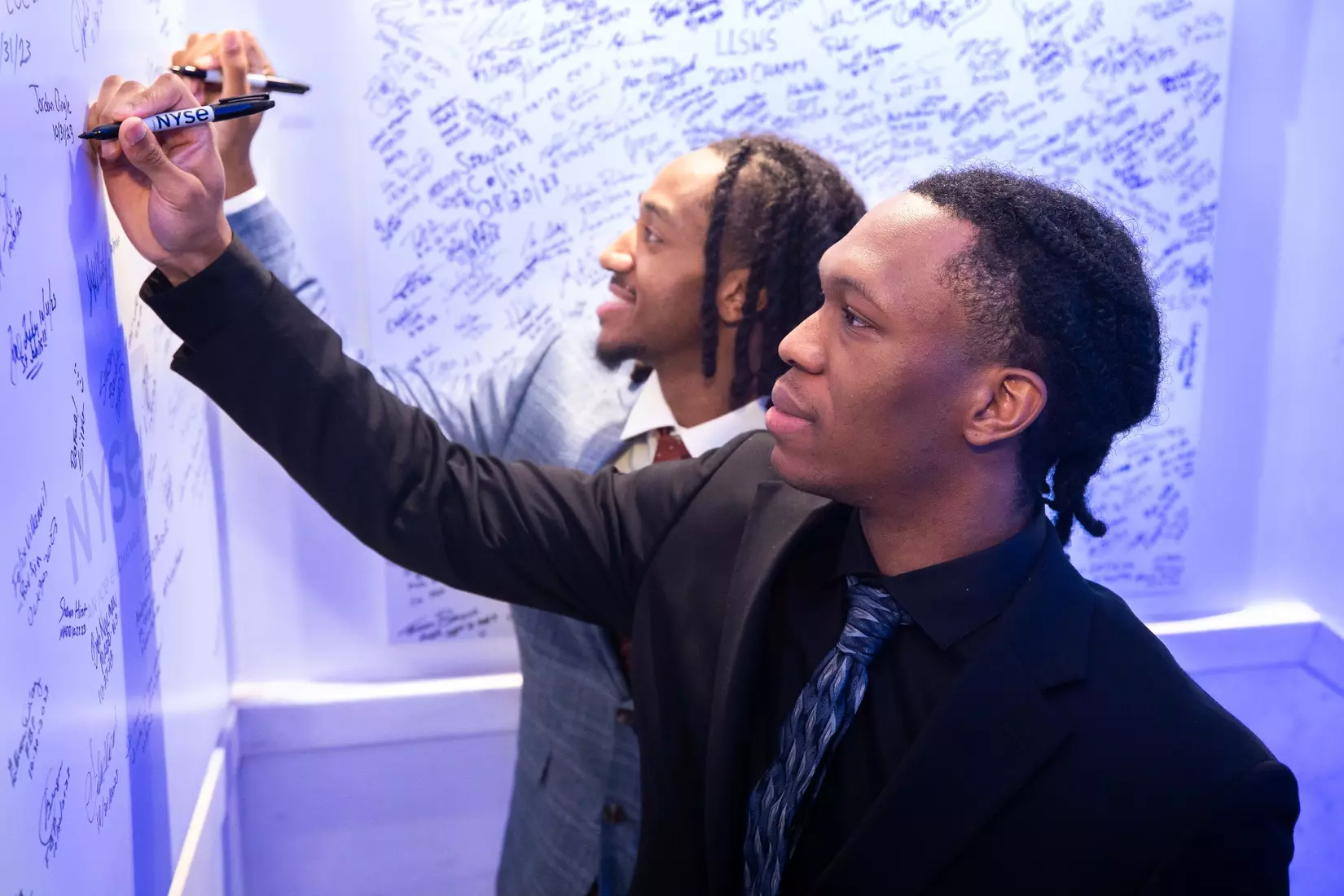 Dannis Jenkins and Jordan Dingle signed the wall at the New York Stock Exchange on Tuesday