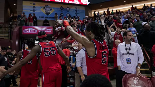 St. John's men's basketball team celebrates third-place finish at the Charleston Classic.
