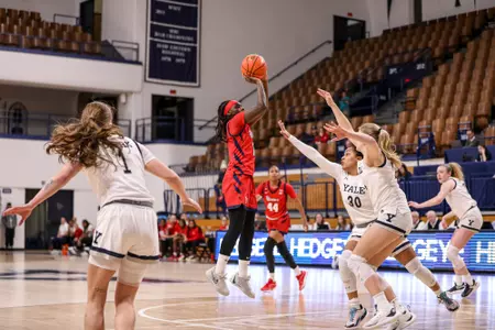 Unique Drake rises up for a mid-range jumper.