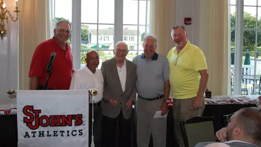 Robert Dillon is pictured in the yellow polo on the far right.