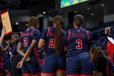 St. John's huddles during a timeout.
