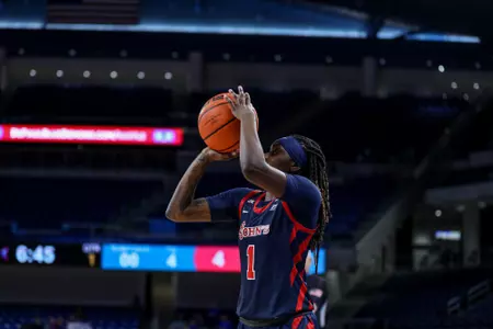 Unique Drake attempts a jump shot.