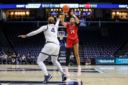 Jillian Archer attempts a mid-range jump shot.