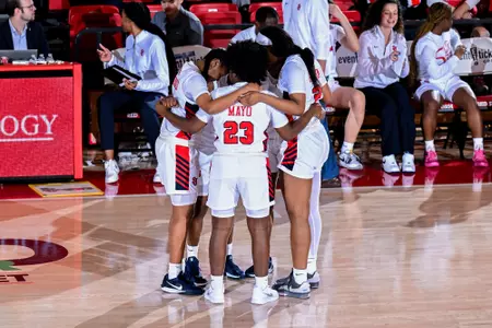 St. John's huddles during a stoppage in play.