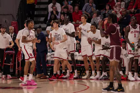 The St. John's bench celebrates after a score.