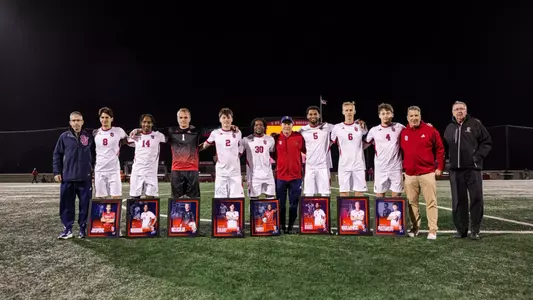 St. John's seniors Julian Jakopovic, Ank Nibogora, Alec McLachlan, Jeremy Sharp, Godwin Partey, Antonio Biggs, Bjorn Nikolajewski and Markus Pusztahegyi pose together on Senior Night.