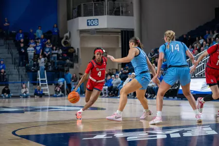 Skye Owen drives by a Creighton defender.