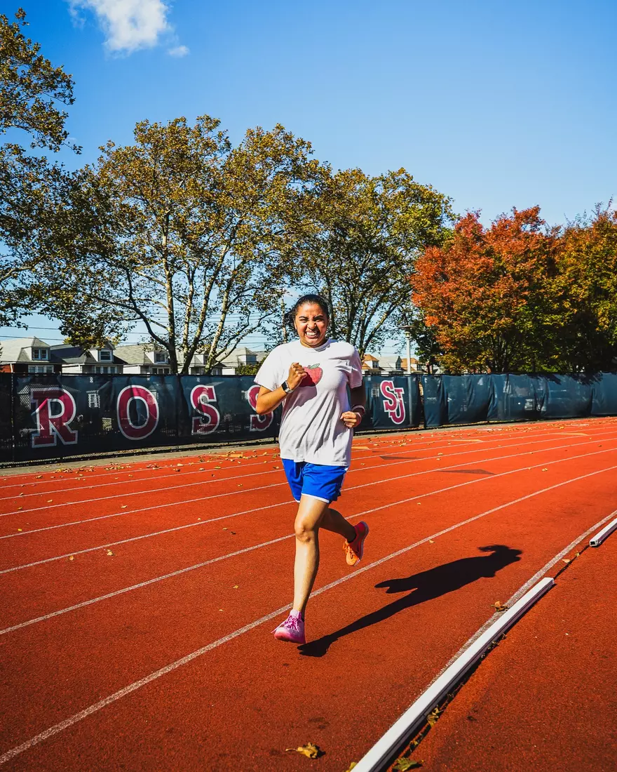 Members of QCP walking the track at the DaSilva Athletic Complex.