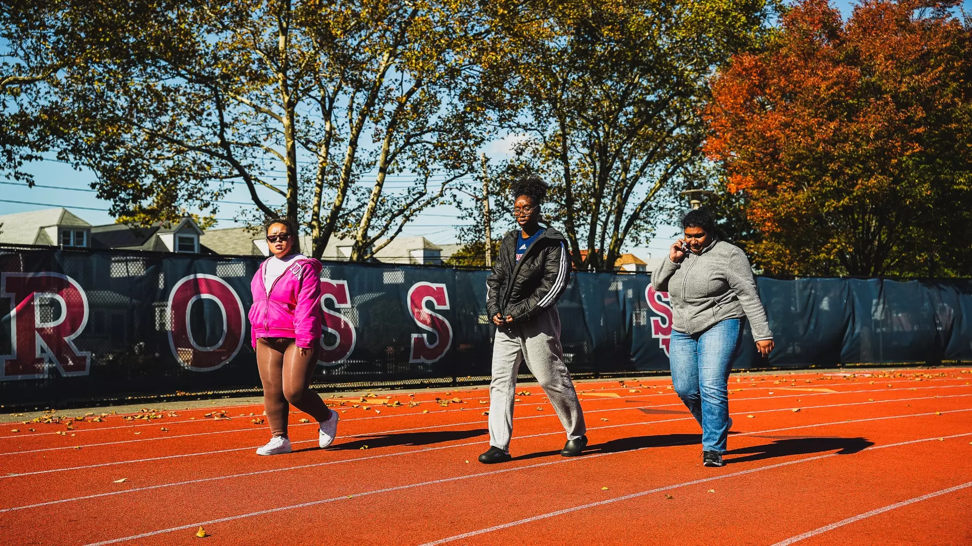 Members of QCP walking the track at the DaSilva Athletic Complex.