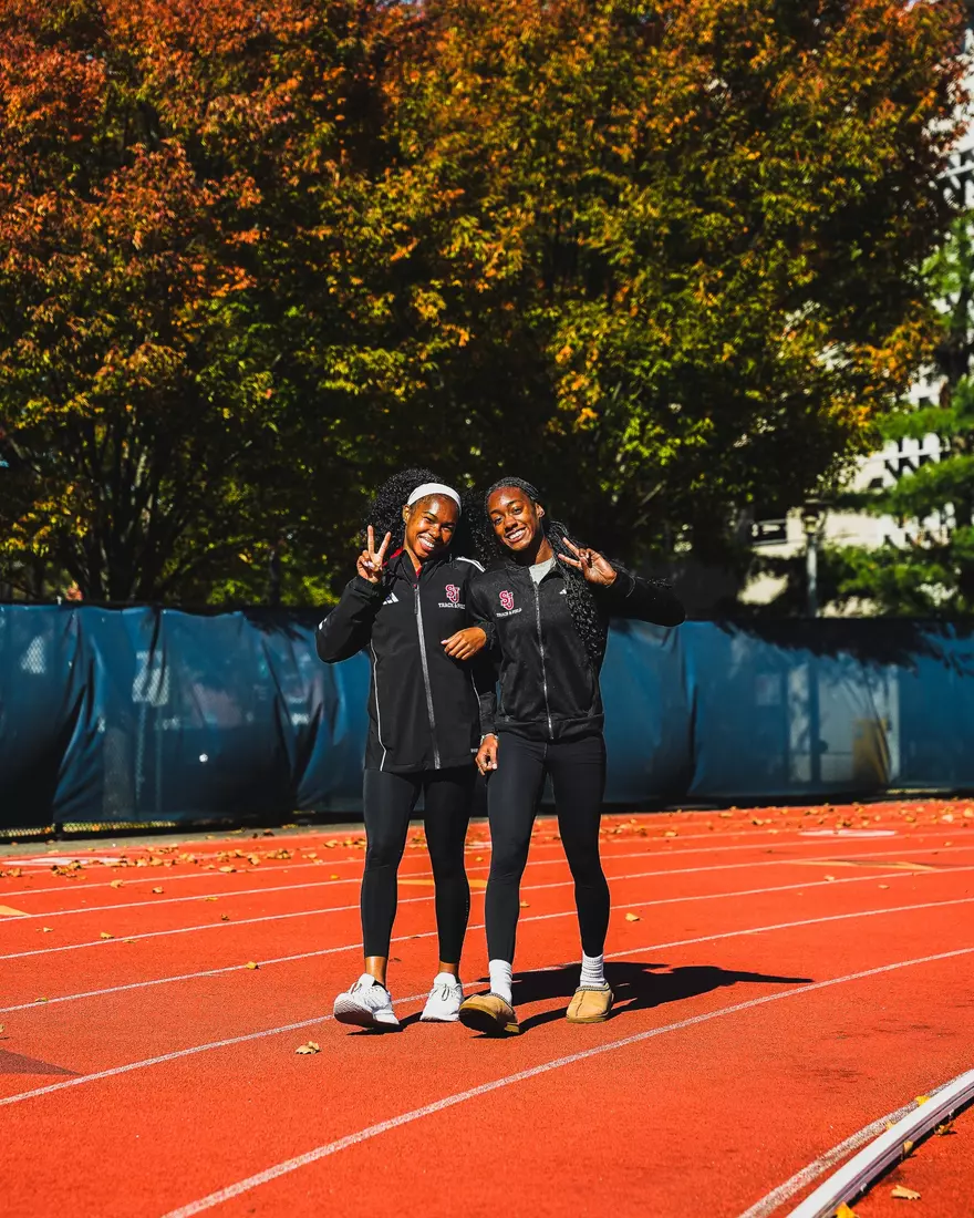 Members of SJUTF walking the track at the DaSilva Athletic Complex.