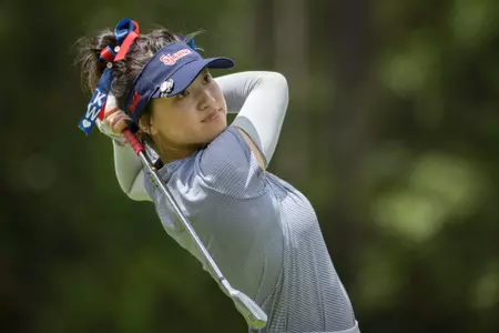 Kelly Wu shot a career-low 4-under, 68, to move into a three-way tie for first place