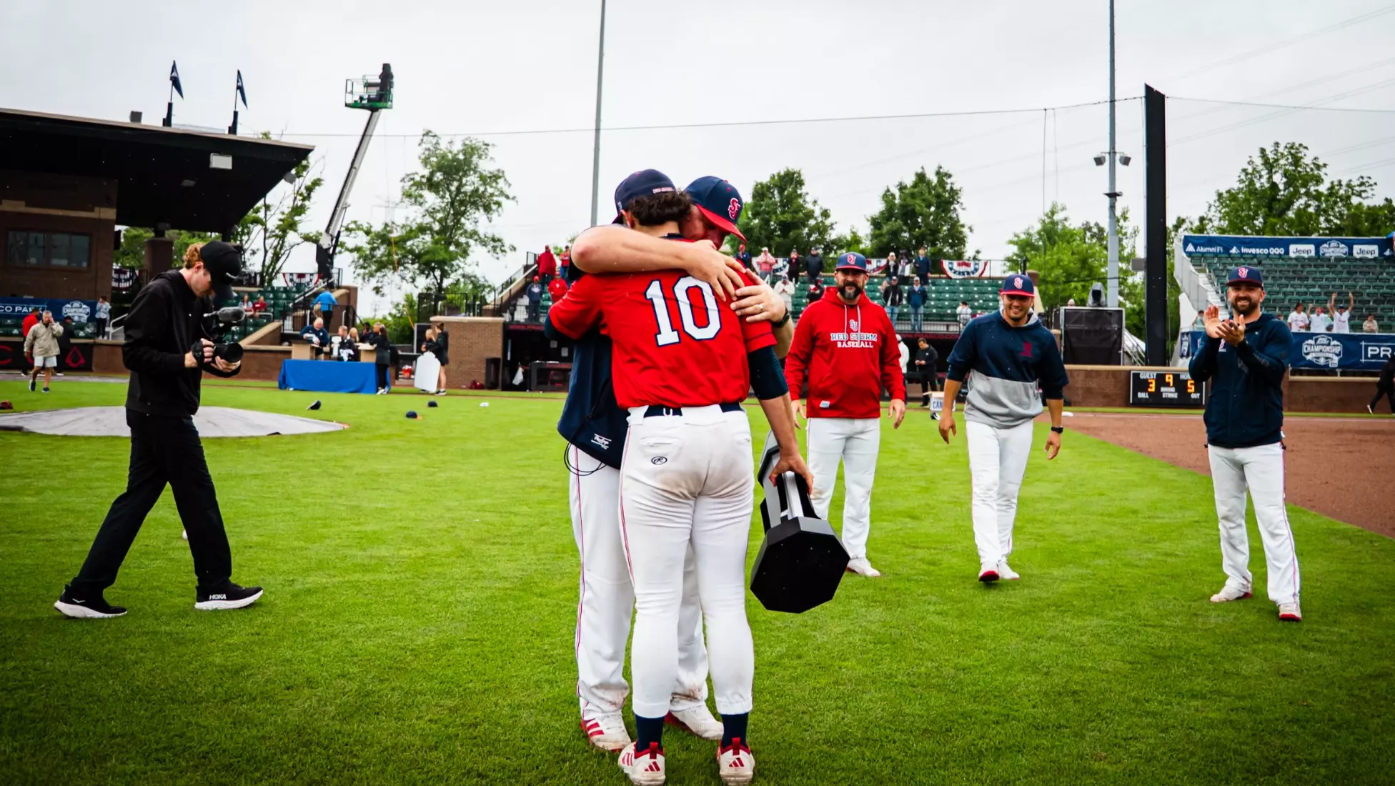 Dylan Johnson and Head Coach Mike Hampton Hug Post Win