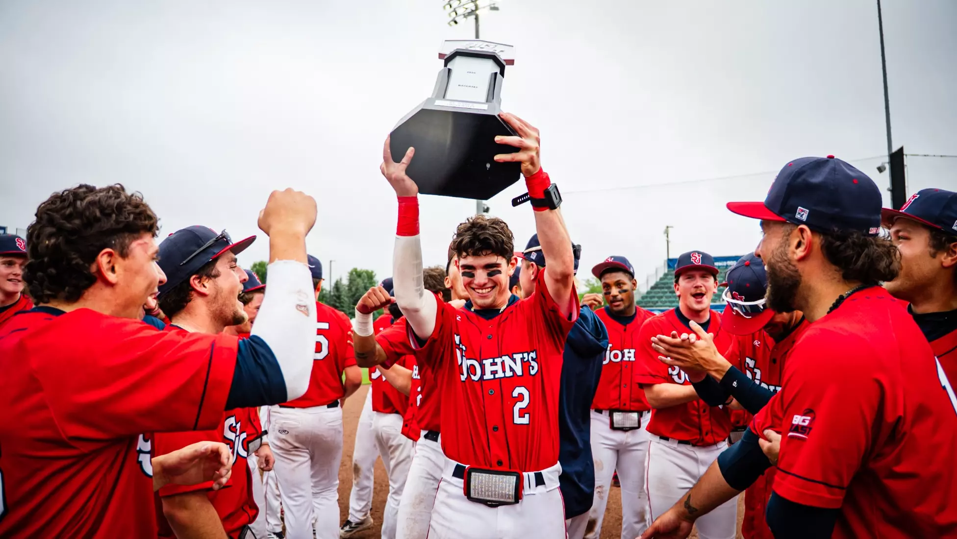 Will Cowan holds up the 2026 BIG EAST Baseball Championship trophy