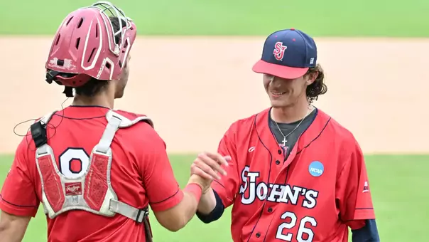 Nick Romer and Adam Agresti after securing the victory. Romer closed out the game for the Johnnies with a pair strikeouts in a scoreless ninth