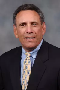 Charlie Rizzo will add defensive coordinator duties for the Owls