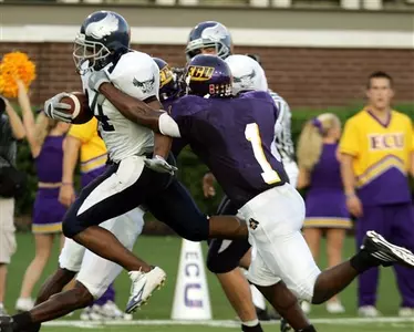 Quinton Smith leaps into the end zone for a touchdown.