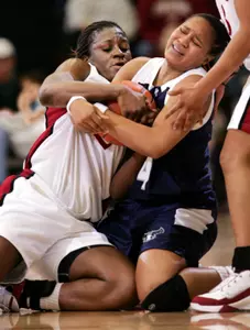 Stanford forward Eziamaka Okafor, left, and guard Rosyland Jeffries, right, fight for loose ball at half court. (AP Photo/Paul Sakuma)