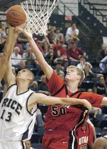 Rice's Paulius Packevicius battles for a rebound.