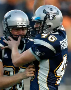 Walk on kicker Clark Fangmeier celebrates after kicking the game-winner
