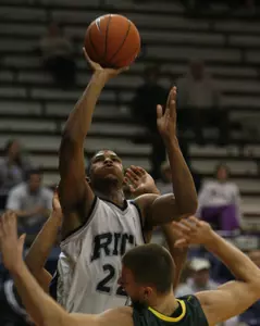 Morris Almond shoots over Oregon's Adam Zahn, bottom, in the first half. (AP Photo)