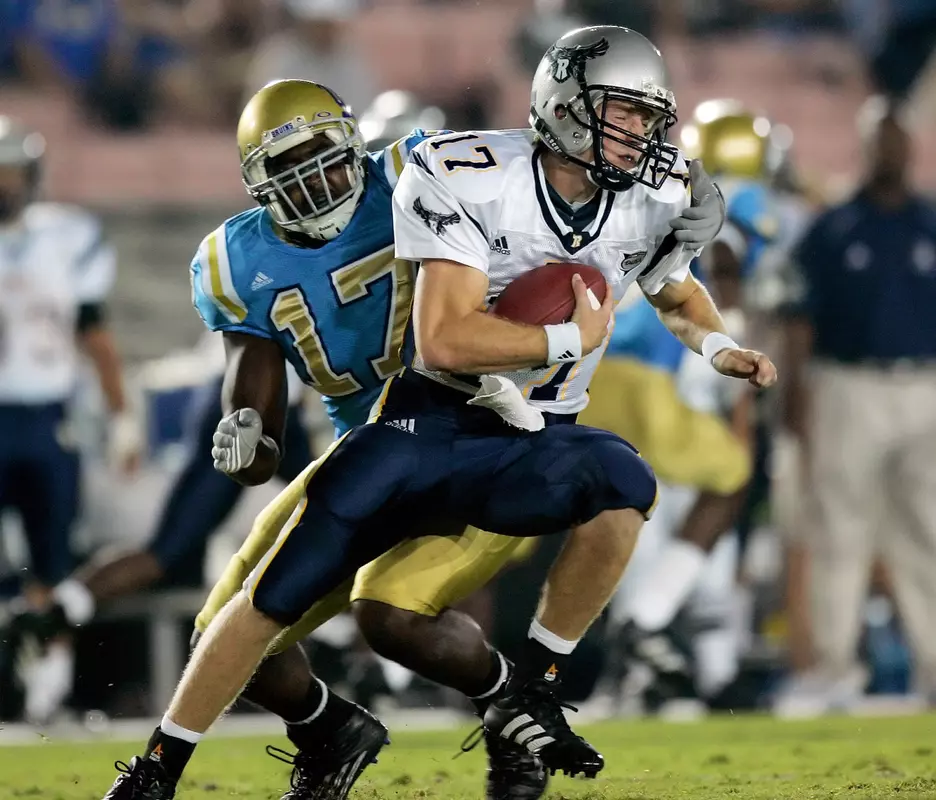John Shepherd dodges the UCLA defense in the first quarter. (AP Photo)