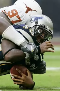 Rice quarterback Joel Armstrong endured constant pressure while throwing for 180 yards