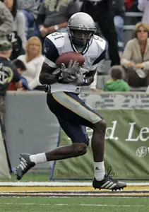 Rice's Jarett Dillard hauls in a pass from quarterback Chase Clement which Dillard ran in for a touchdown in the first half of a football game against Army. (AP Photo/Jim McKnight)