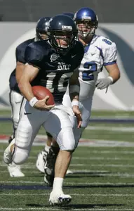 Rice quarterback Chase Clement breaks lose in the first half. Memphis defender Ryan Williams is left behind. (AP Photo/Pat Sullivan)